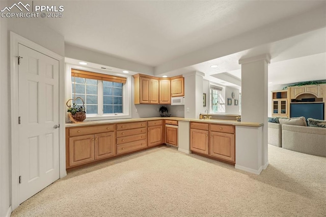 3479 Hill Cir, Colorado Springs, CO 80904 - kitchen featuring recessed lighting, open floor plan, light countertops, light carpet, and white microwave