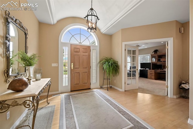 3479 Hill Cir, Colorado Springs, CO 80904 - foyer featuring light wood finished floors, plenty of natural light, french doors, vaulted ceiling, and a ceiling fan