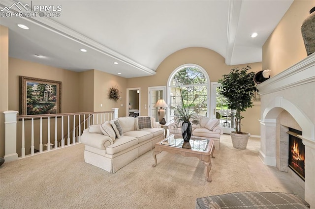 3479 Hill Cir, Colorado Springs, CO 80904 - carpeted living area featuring recessed lighting, a warm lit fireplace, and vaulted ceiling