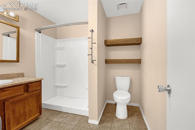 1810 Lanka Ln, Colorado Springs, CO 80915 - bathroom with tile patterned flooring, vanity, toilet, a shower, and baseboards