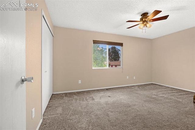 1810 Lanka Ln, Colorado Springs, CO 80915 - unfurnished bedroom featuring carpet floors, a textured ceiling, a closet, baseboards, and ceiling fan
