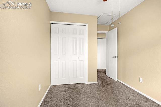 1810 Lanka Ln, Colorado Springs, CO 80915 - unfurnished bedroom featuring carpet, a closet, baseboards, a ceiling fan, and a textured ceiling