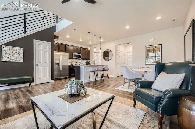 1747 Satin Spar Pt, Colorado Springs, CO 80908 - living room with light wood-type flooring, recessed lighting, a ceiling fan, and baseboards