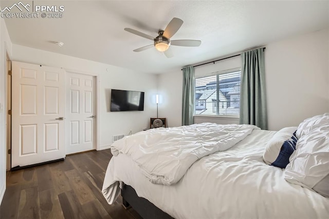 1747 Satin Spar Pt, Colorado Springs, CO 80908 - bedroom with dark wood-type flooring and ceiling fan