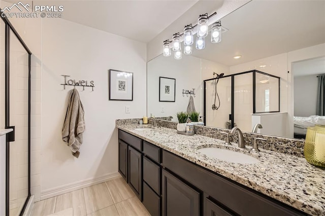 1747 Satin Spar Pt, Colorado Springs, CO 80908 - full bath featuring double vanity, a shower stall, and baseboards