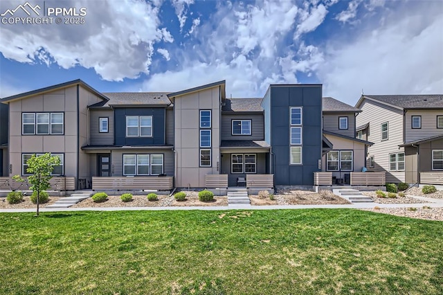 1747 Satin Spar Pt, Colorado Springs, CO 80908 - view of front facade featuring board and batten siding and a front yard