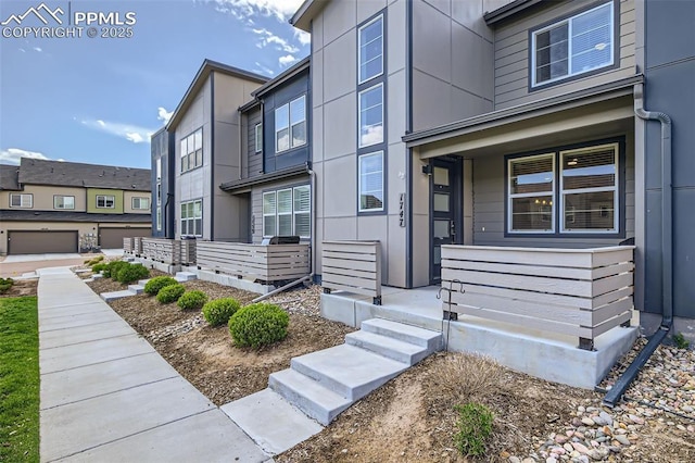 1747 Satin Spar Pt, Colorado Springs, CO 80908 - doorway to property featuring covered porch
