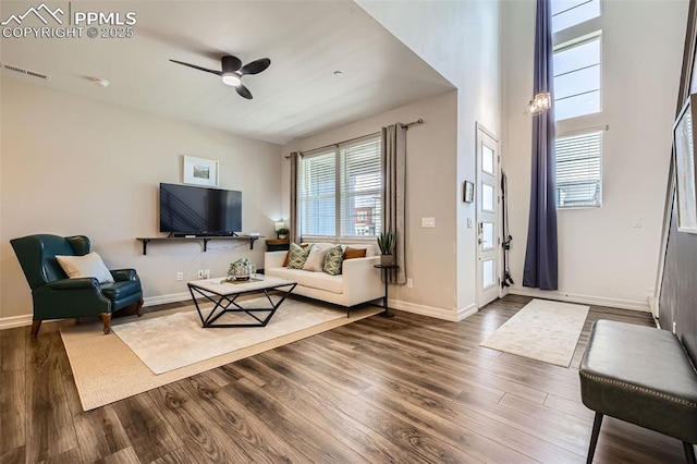 1747 Satin Spar Pt, Colorado Springs, CO 80908 - living room with dark wood-type flooring, a ceiling fan, and baseboards
