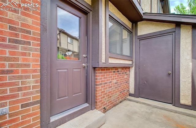 5573 Tamworth Dr, Colorado Springs, CO 80919 - entrance to property featuring brick siding and stucco siding