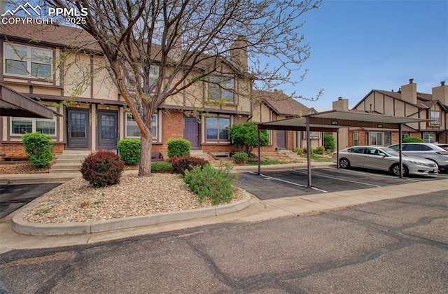 5573 Tamworth Dr, Colorado Springs, CO 80919 - multi unit property with covered and uncovered parking, brick siding, and a residential view