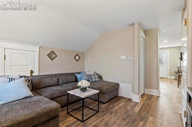 1807 W Colorado Ave, Colorado Springs, CO 80904 - living area with wood finished floors, baseboards, and lofted ceiling