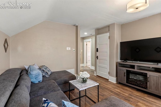 1807 W Colorado Ave, Colorado Springs, CO 80904 - living room with wood finished floors, baseboards, lofted ceiling, and recessed lighting