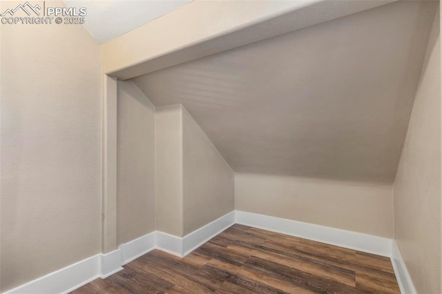 1807 W Colorado Ave, Colorado Springs, CO 80904 - bonus room with lofted ceiling, dark wood-style flooring, and baseboards