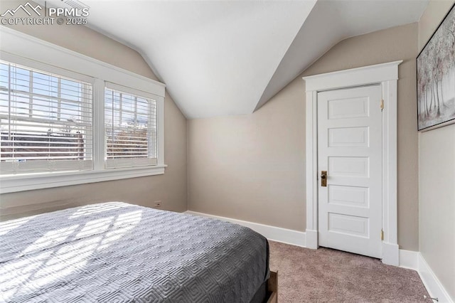 1807 W Colorado Ave, Colorado Springs, CO 80904 - carpeted bedroom featuring vaulted ceiling and baseboards