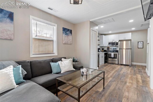 1807 W Colorado Ave, Colorado Springs, CO 80904 - living area featuring light wood-style floors, recessed lighting, and baseboards