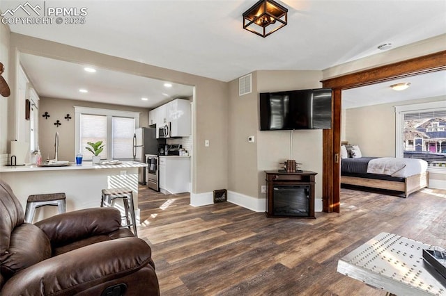 1807 W Colorado Ave, Colorado Springs, CO 80904 - living area featuring dark wood finished floors, baseboards, and recessed lighting