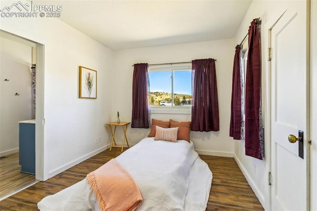 133 W Golden Ave, Cripple Creek, CO 80813 - bedroom featuring wood finished floors and baseboards