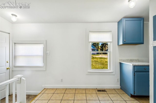 133 W Golden Ave, Cripple Creek, CO 80813 - unfurnished dining area with baseboards and light tile patterned floors