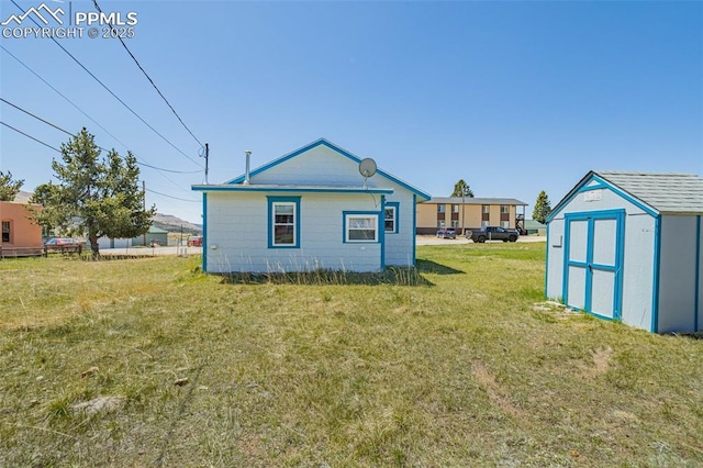 133 W Golden Ave, Cripple Creek, CO 80813 - rear view of property featuring a lawn