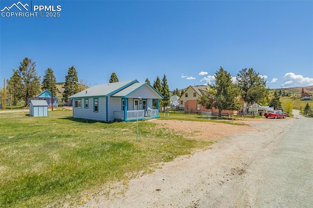 133 W Golden Ave, Cripple Creek, CO 80813 - view of front of home with a front yard and covered porch