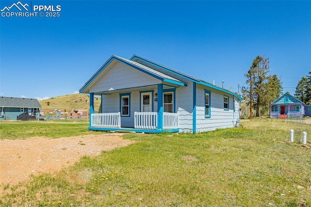 133 W Golden Ave, Cripple Creek, CO 80813 - view of front of home with a porch and a front lawn