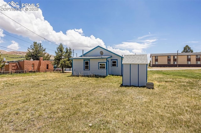 133 W Golden Ave, Cripple Creek, CO 80813 - rear view of property with a yard