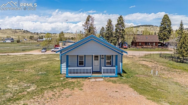 133 W Golden Ave, Cripple Creek, CO 80813 - view of front of house with covered porch and a mountain view
