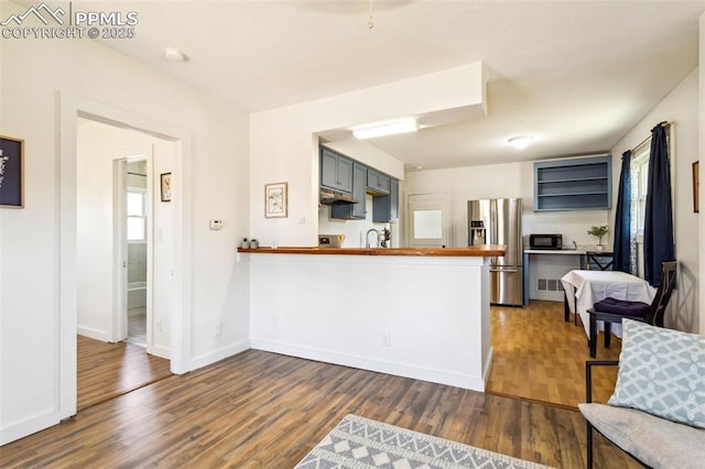 133 W Golden Ave, Cripple Creek, CO 80813 - kitchen featuring stainless steel fridge with ice dispenser, dark wood finished floors, and plenty of natural light