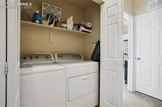 4219 Mesa Point, Colorado Springs, CO 80923 - laundry room with separate washer and dryer and light colored carpet