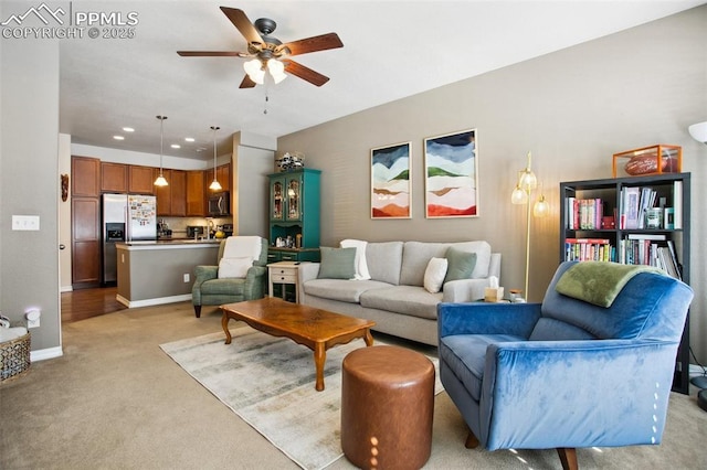 4219 Mesa Point, Colorado Springs, CO 80923 - living room featuring light colored carpet, a ceiling fan, and baseboards