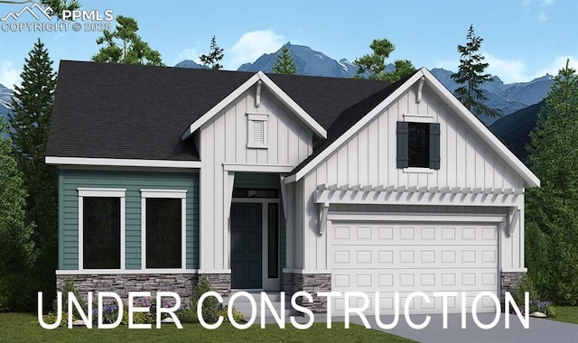 17263 Crimson Clover Dr, Monument, CO 80132 - view of front of house featuring board and batten siding, stone siding, a mountain view, and concrete driveway