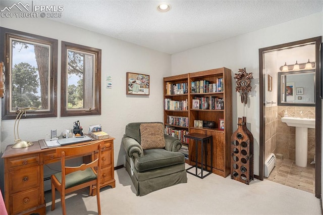 2518 Avondale Dr, Colorado Springs, CO 80917 - carpeted office space with tile walls, a textured ceiling, a baseboard radiator, and recessed lighting