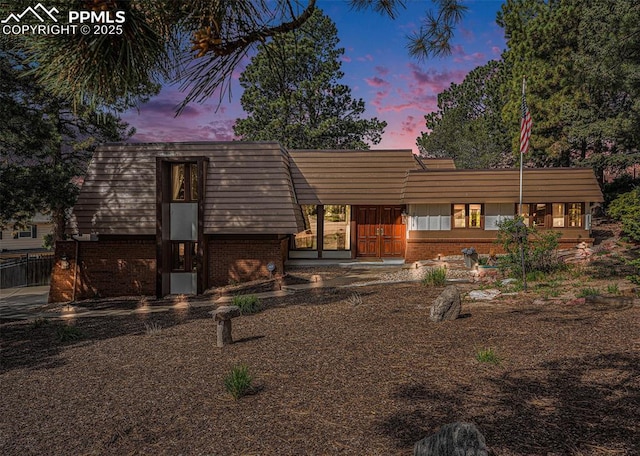 2518 Avondale Dr, Colorado Springs, CO 80917 - view of front of home featuring brick siding and mansard roof