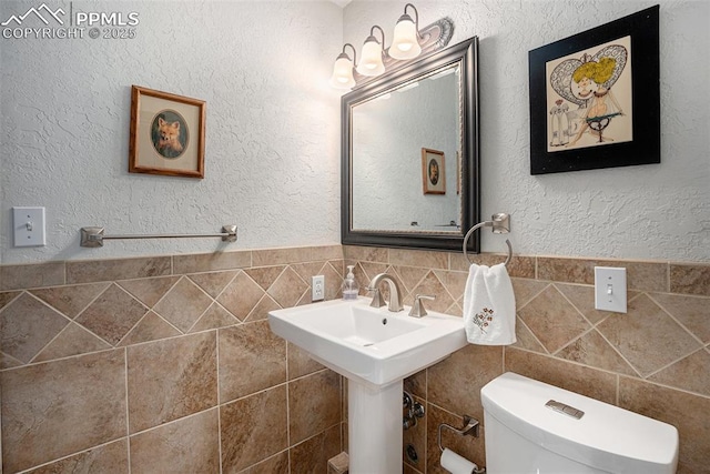 2518 Avondale Dr, Colorado Springs, CO 80917 - bathroom with toilet and tile walls