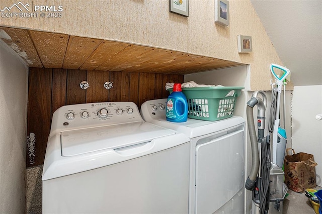 2518 Avondale Dr, Colorado Springs, CO 80917 - laundry room with washing machine and clothes dryer and wood walls