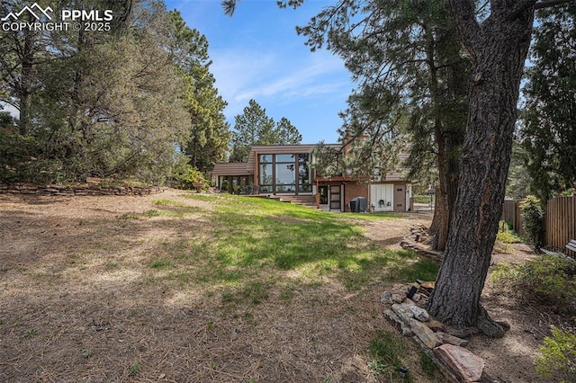 2518 Avondale Dr, Colorado Springs, CO 80917 - view of yard featuring a sunroom