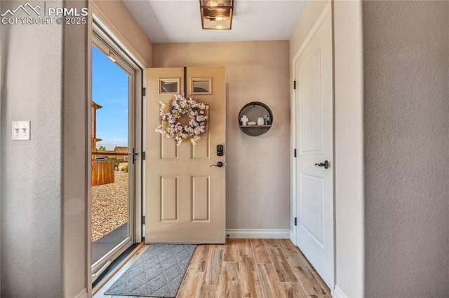 6728 Gelbvieh Rd, Peyton, CO 80831 - entrance foyer with wood finished floors and baseboards