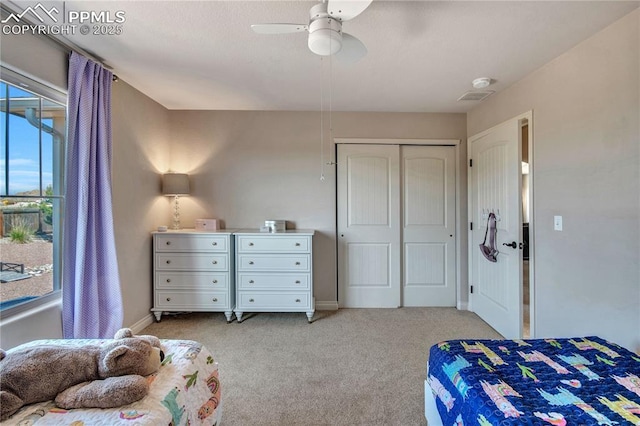 6728 Gelbvieh Rd, Peyton, CO 80831 - bedroom featuring light colored carpet, a closet, and a ceiling fan