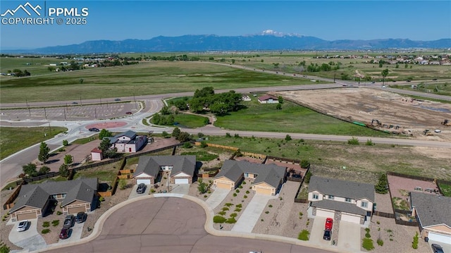 6728 Gelbvieh Rd, Peyton, CO 80831 - aerial perspective of suburban area featuring a mountain backdrop