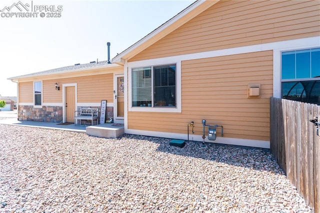 6728 Gelbvieh Rd, Peyton, CO 80831 - rear view of property featuring a patio area and stone siding