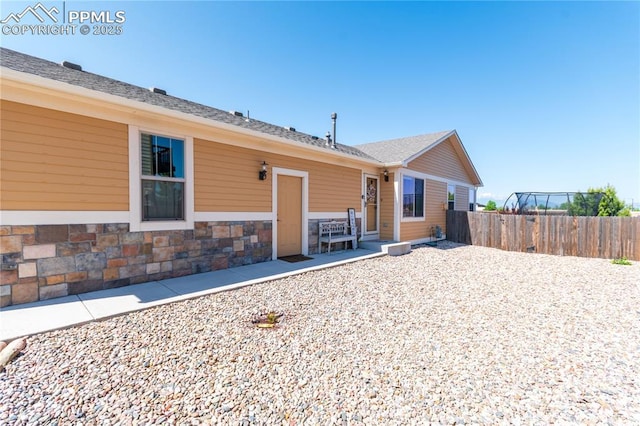 6728 Gelbvieh Rd, Peyton, CO 80831 - back of property featuring stone siding