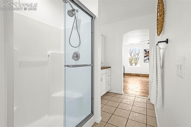 321 Graceland Grv, Colorado Springs, CO 80904 - full bathroom featuring a shower stall, tile patterned flooring, and baseboards