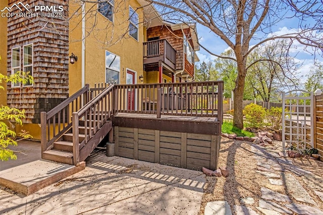 321 Graceland Grv, Colorado Springs, CO 80904 - back of property with a balcony, stucco siding, and a deck