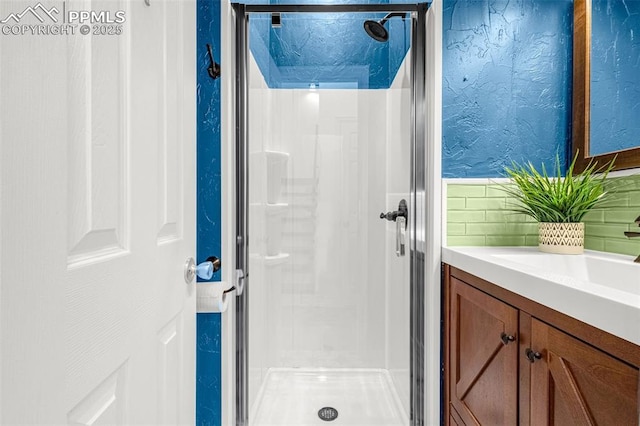 321 Graceland Grv, Colorado Springs, CO 80904 - full bathroom featuring a stall shower, vanity, and backsplash