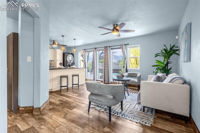 321 Graceland Grv, Colorado Springs, CO 80904 - living area with ceiling fan, wood finished floors, and baseboards