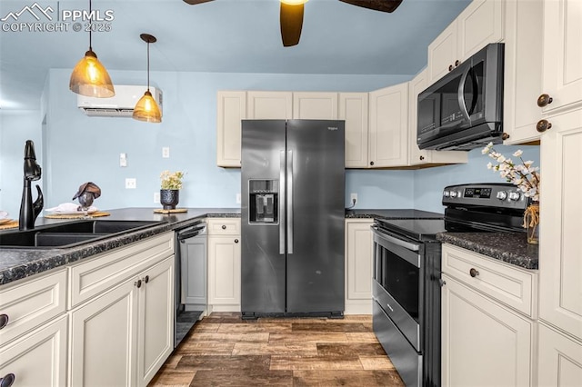 321 Graceland Grv, Colorado Springs, CO 80904 - kitchen featuring stainless steel appliances, a sink, ceiling fan, wood finished floors, and dark countertops