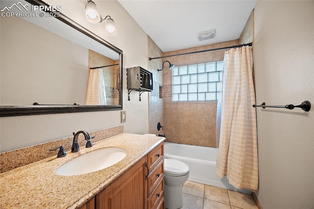 1515 W Boulder St, Colorado Springs, CO 80904 - bathroom featuring vanity, shower / bath combination with curtain, toilet, and tile patterned flooring