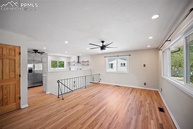 1515 W Boulder St, Colorado Springs, CO 80904 - unfurnished living room featuring ceiling fan, light wood-style floors, baseboards, and recessed lighting