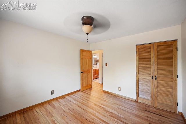 1515 W Boulder St, Colorado Springs, CO 80904 - unfurnished bedroom with baseboards, light wood finished floors, a closet, and a ceiling fan