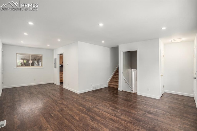1125 Moffat Cir, Colorado Springs, CO 80915 - unfurnished room featuring recessed lighting, stairway, wood finished floors, and baseboards